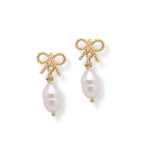 The Eloise Bow Earrings feature plated gold bow studs and freshwater pearls. They're the perfect dainty accessory! 

All hardware is nickel free, hypoallergenic, gold plated stainless steel & brass.