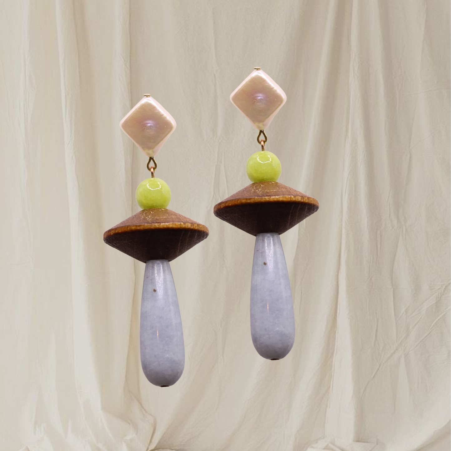 The Veda Earrings are made with reclaimed wooden beads, blue quartz, and freshwater pearls. All hardware is hypoallergenic stainless steel.