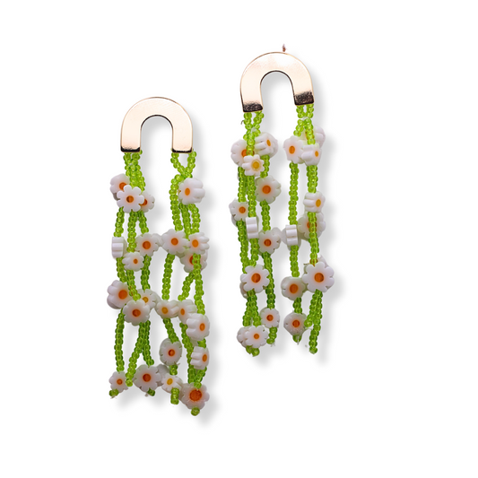 The Camilla earrings are practically pulled from a Monet painting. They feature gold plated hardware and long stands of hand beaded flower vines. 