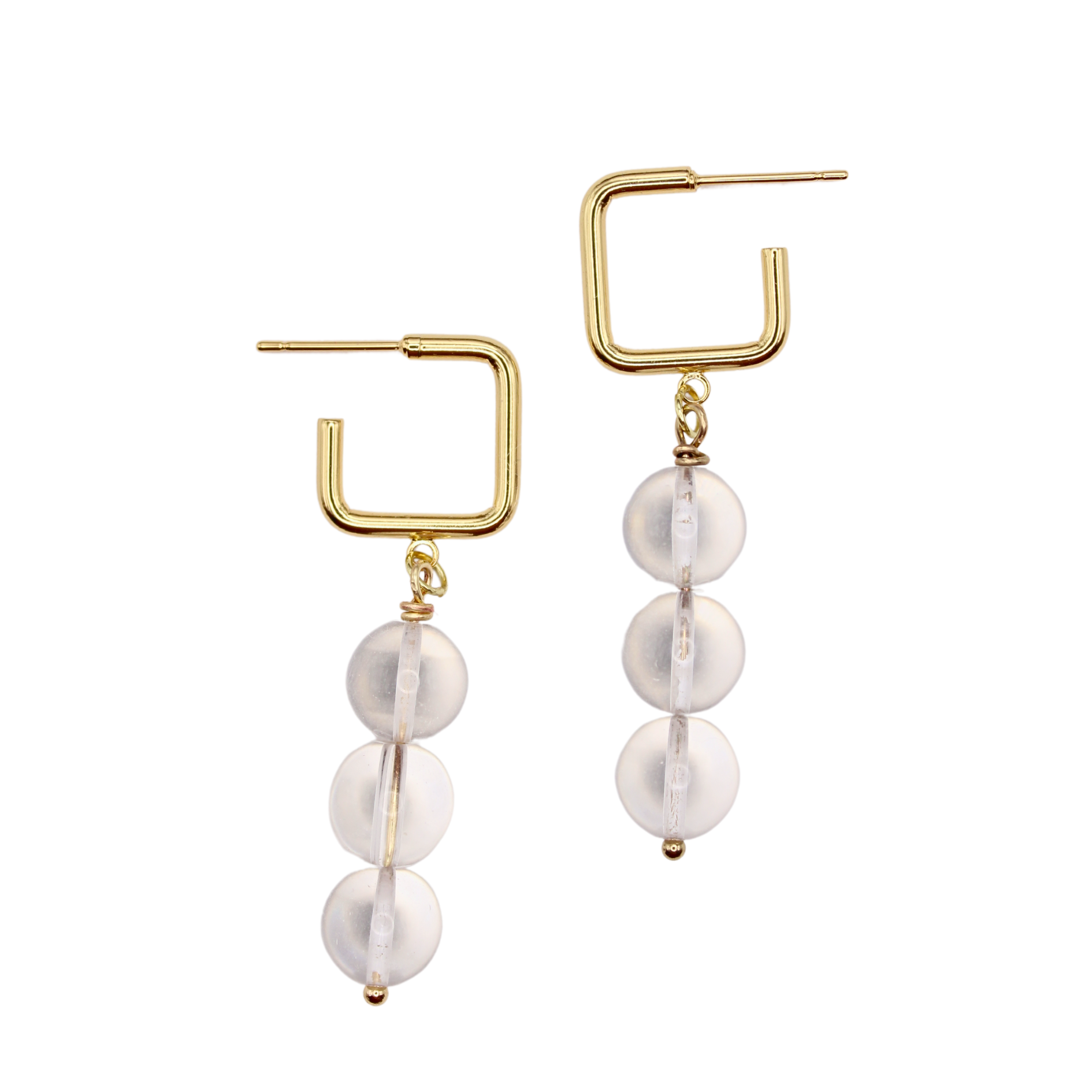 The perfect modern staple, the Imogen square hoops are a classic and minimal staple piece. They are made with hypoallergenic nickel free square hoops and glass beads. 