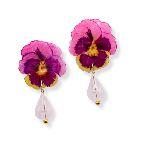 These stunning Pansy earrings are one of a kind. They are hand drawn on acrylic and feature hand blown glass beads. 