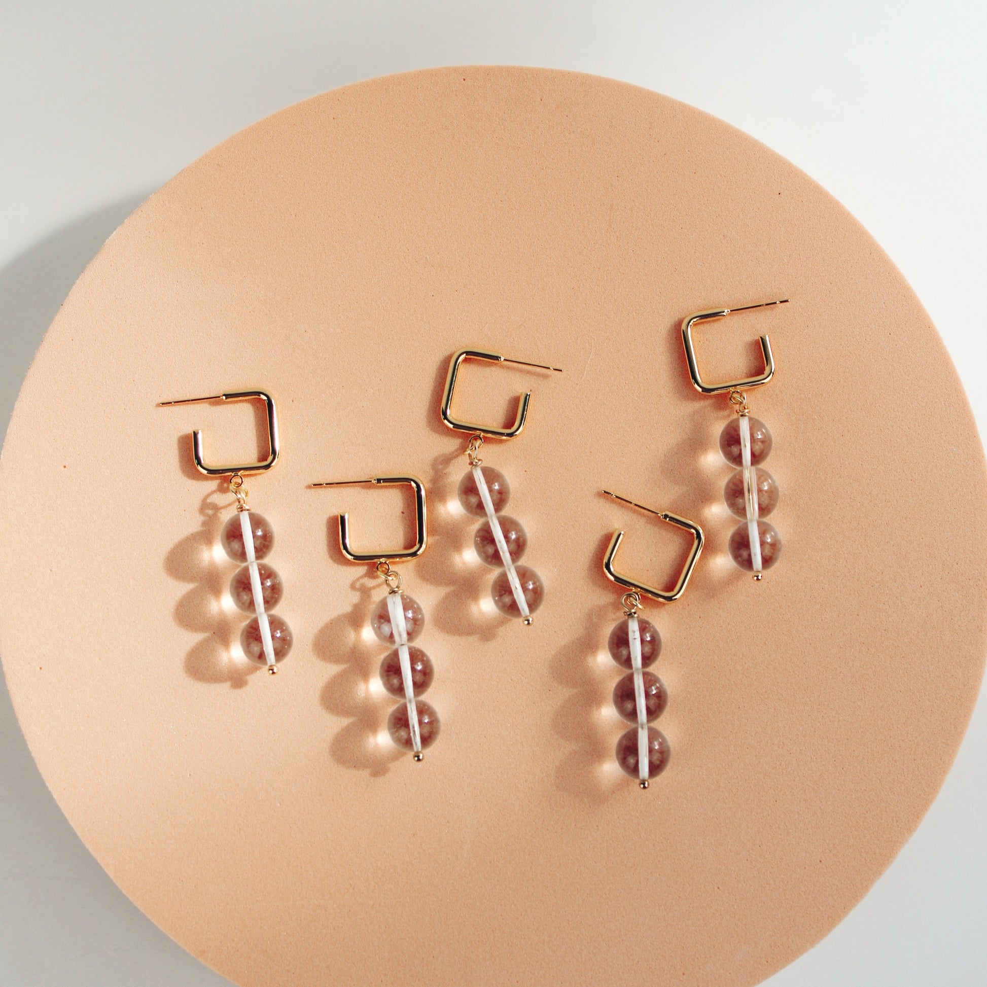 Imogen clear glass beaded hoop earrings on square gold plated hoop designed by Summer Nikole Jewelry in Greenville, SC