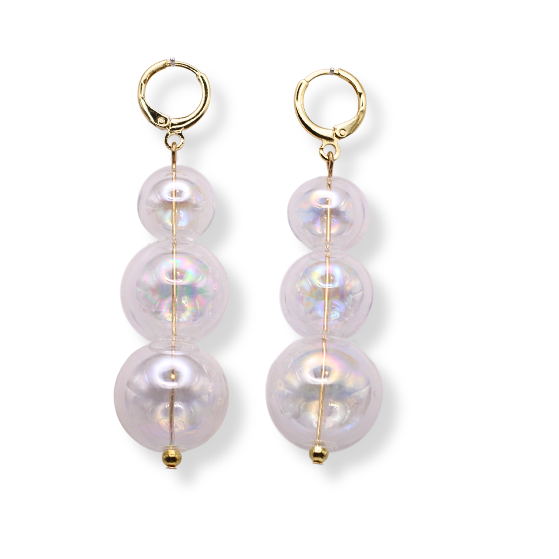 The Penelope earrings can add a whimsical touch to your collection. They are are made with hand blown iridescent glass beads and hypoallergenic Huggie hoops. They’re the perfect balance between minimal and show stopping!